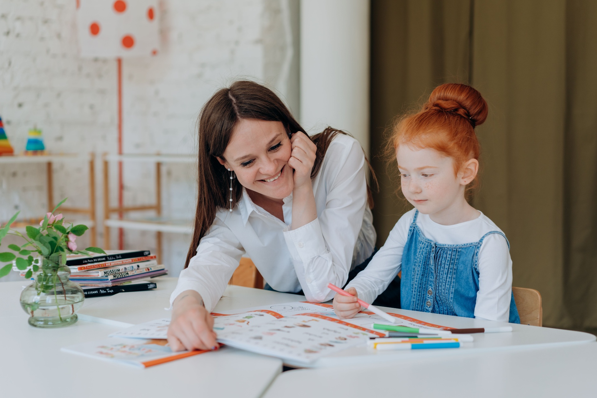 Speech pathologist working one-on-one with a young student