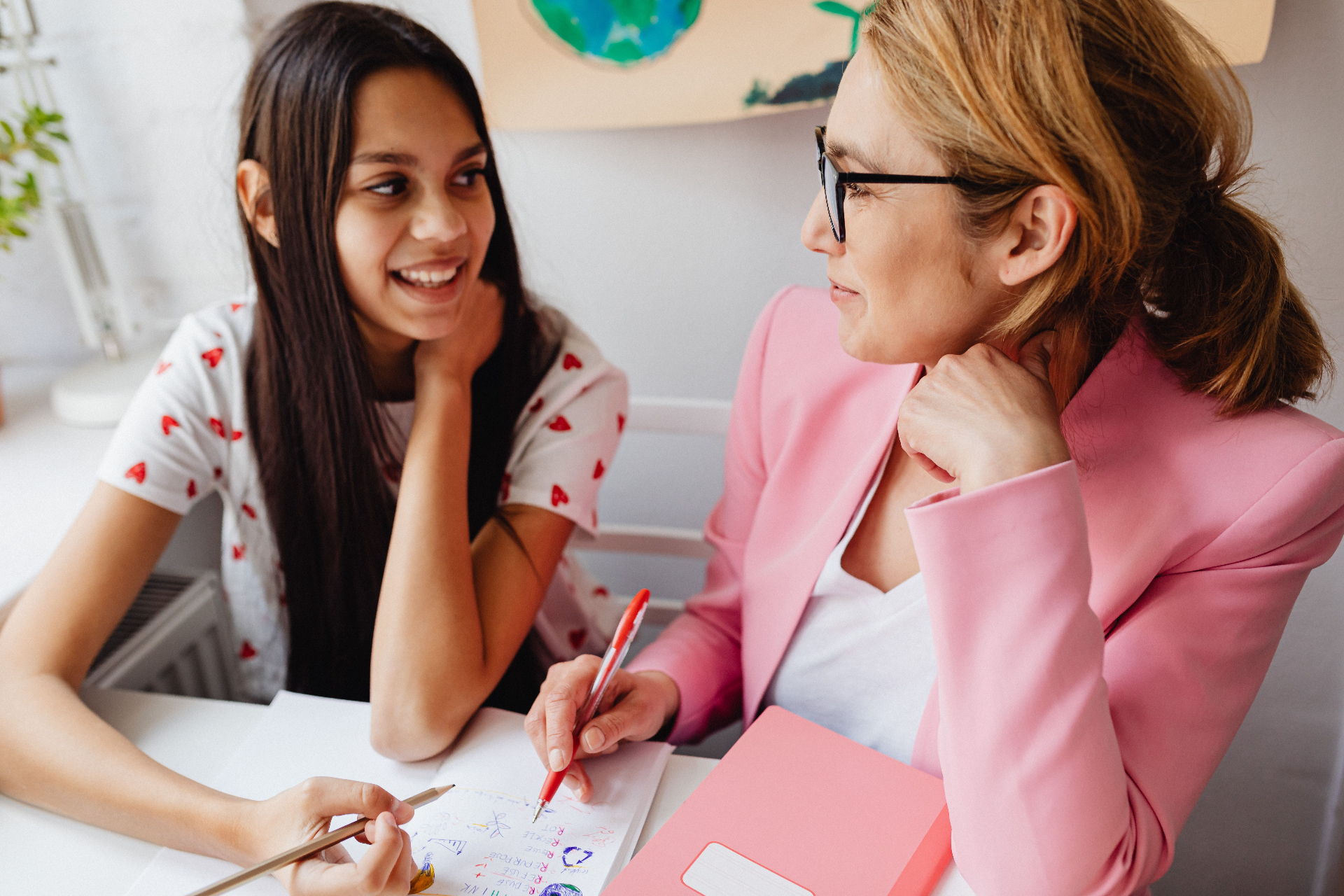 Speech pathologist assessing a young student